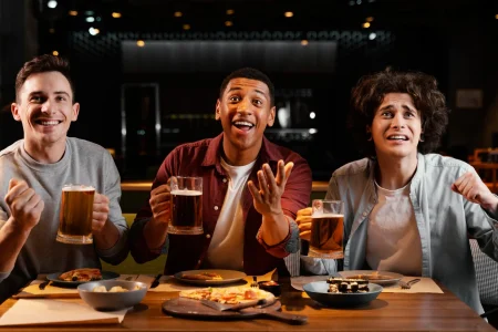 Happy friends with beer in pub Happy friends with beer in pub